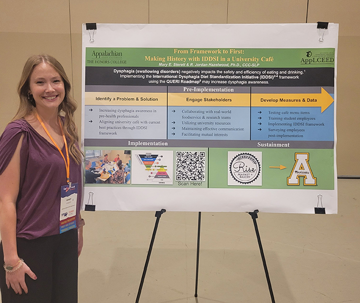 Photo of Mary Sterett at SRHC with poster presentation