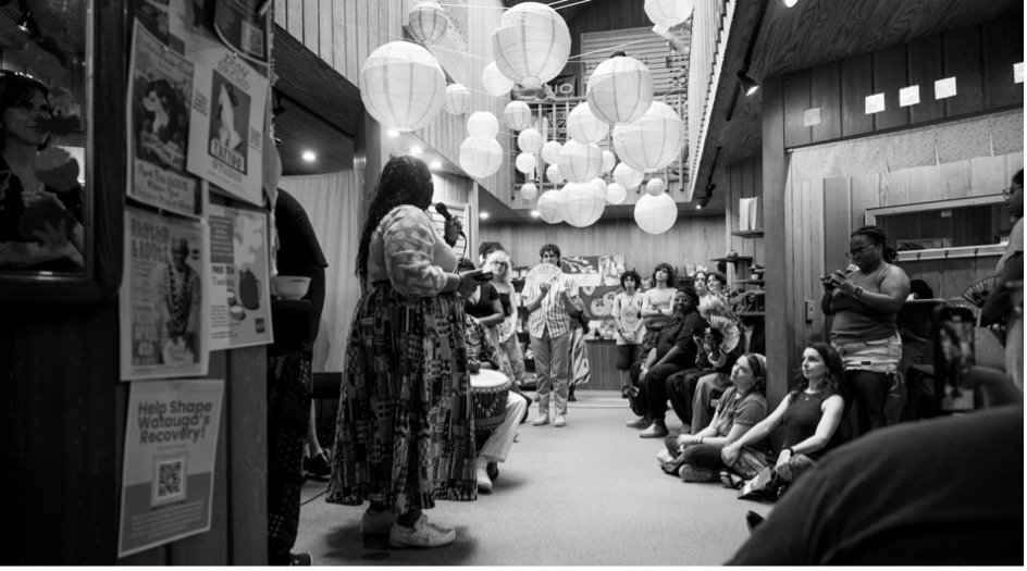 Photo above of Ryan Stukes giving her thesis presentation to audience at The Happy Persimmon, April 2025. Photo submitted.