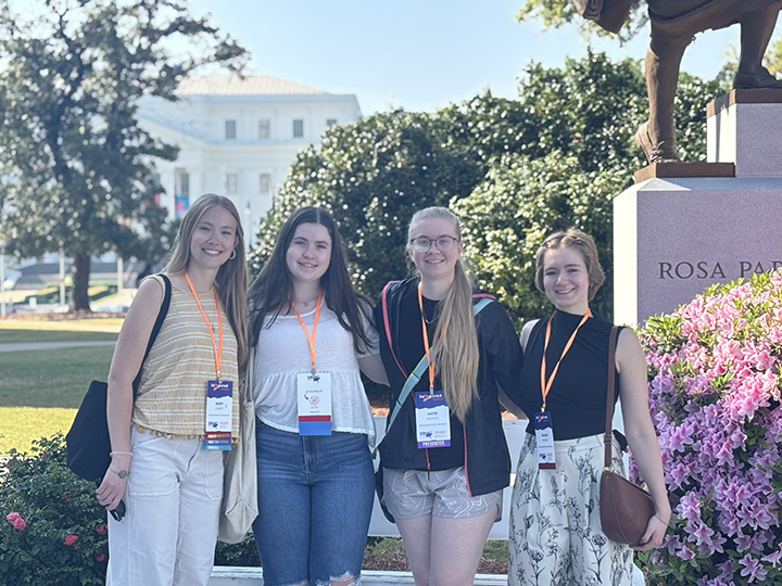 Photo above features Mary Sterett, Lila Rhodes, Katie Rhoades, and Jillian Weidner in front of the Rosa Parks statue at the Alabama state capital building. Photo submitted.