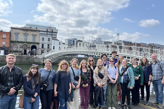Students in the Honors College FLEAP "Peacebuilding and the Arts" in front of the ornate Ha'penny Bridge in Dublin, Ireland, June 10, 2025.