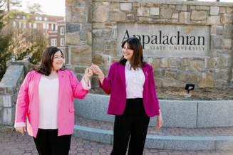 SGA 2024-2025 student body president Kathryn Long and vice president Amarah Din, in front of the App State university sign&nbsp;in Founders Plaza