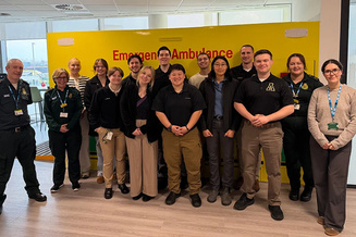 App State Mountaineer Medics students and staff members stand in a group while paying a visit to the London Ambulance Service.