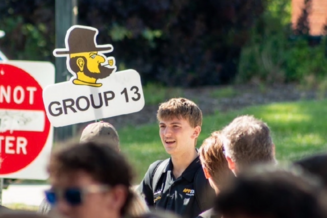 Andrew White leading his orientation Group 13, summer 2026.